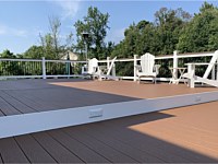 <b>Trex Select Saddle Composite Deck with White Washington Vinyl Railing with round aluminum balusters and a matching drink rail 2</b>